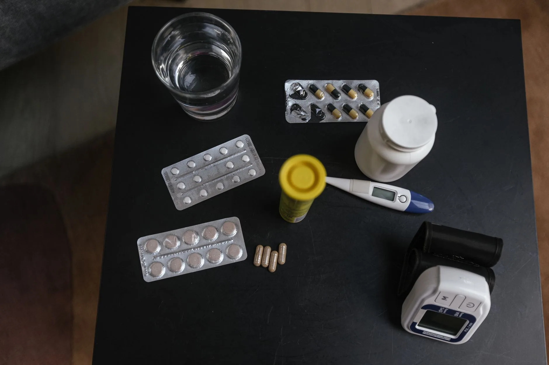 Prescription medication bottles and pills on a table