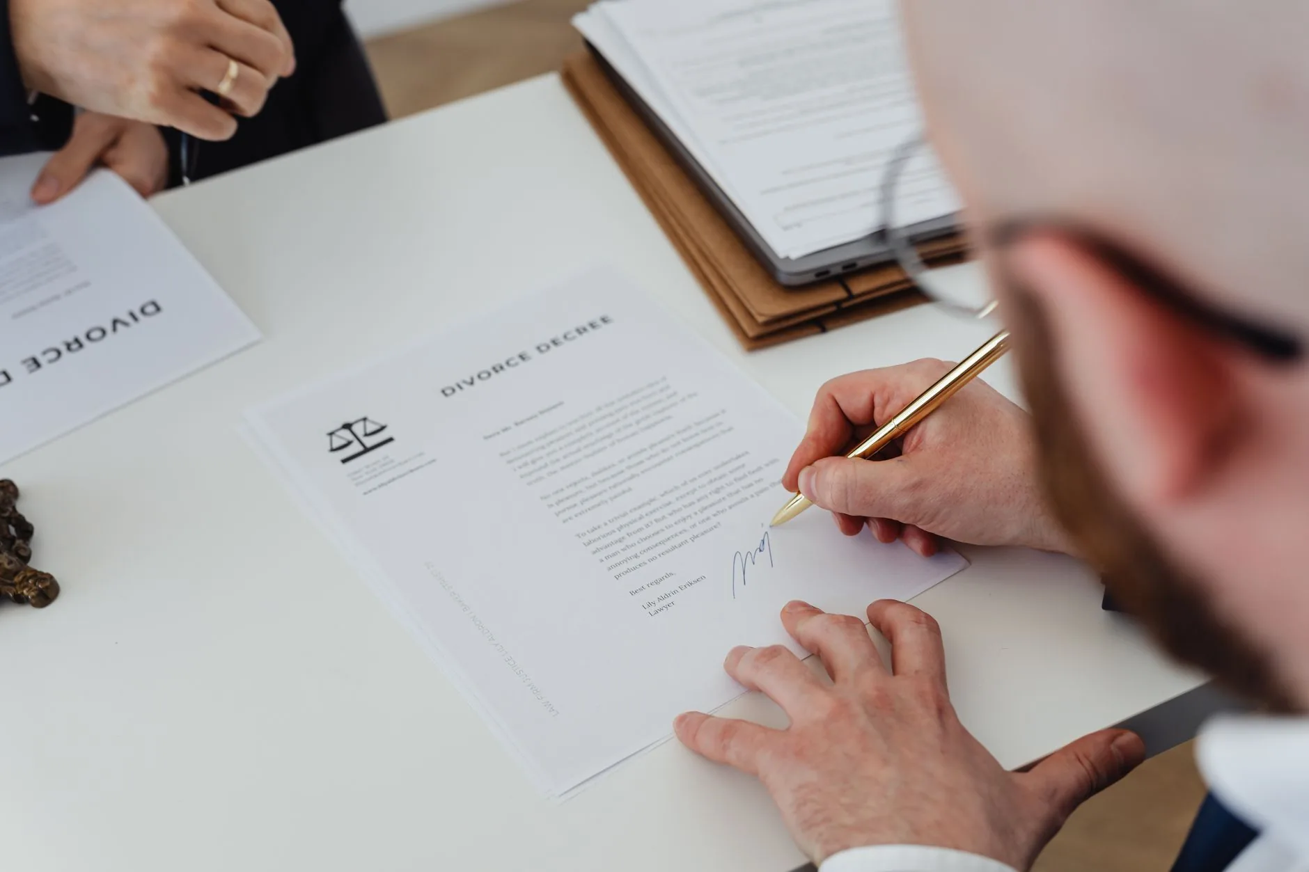 Signing an official document with a pen