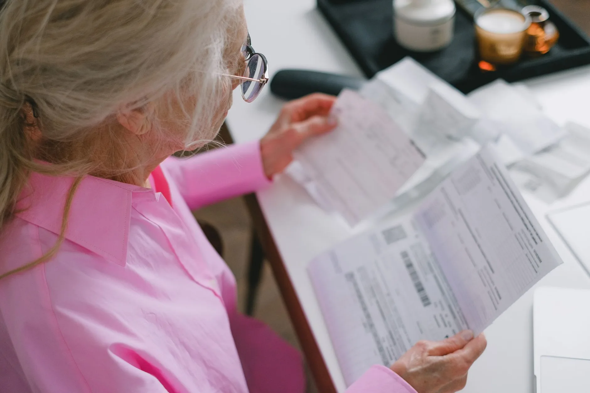 A Medicare plan member reading the annual notice of change letter from their insurer